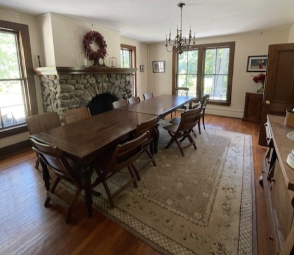 Elegant Dining Room with Stone Fireplace